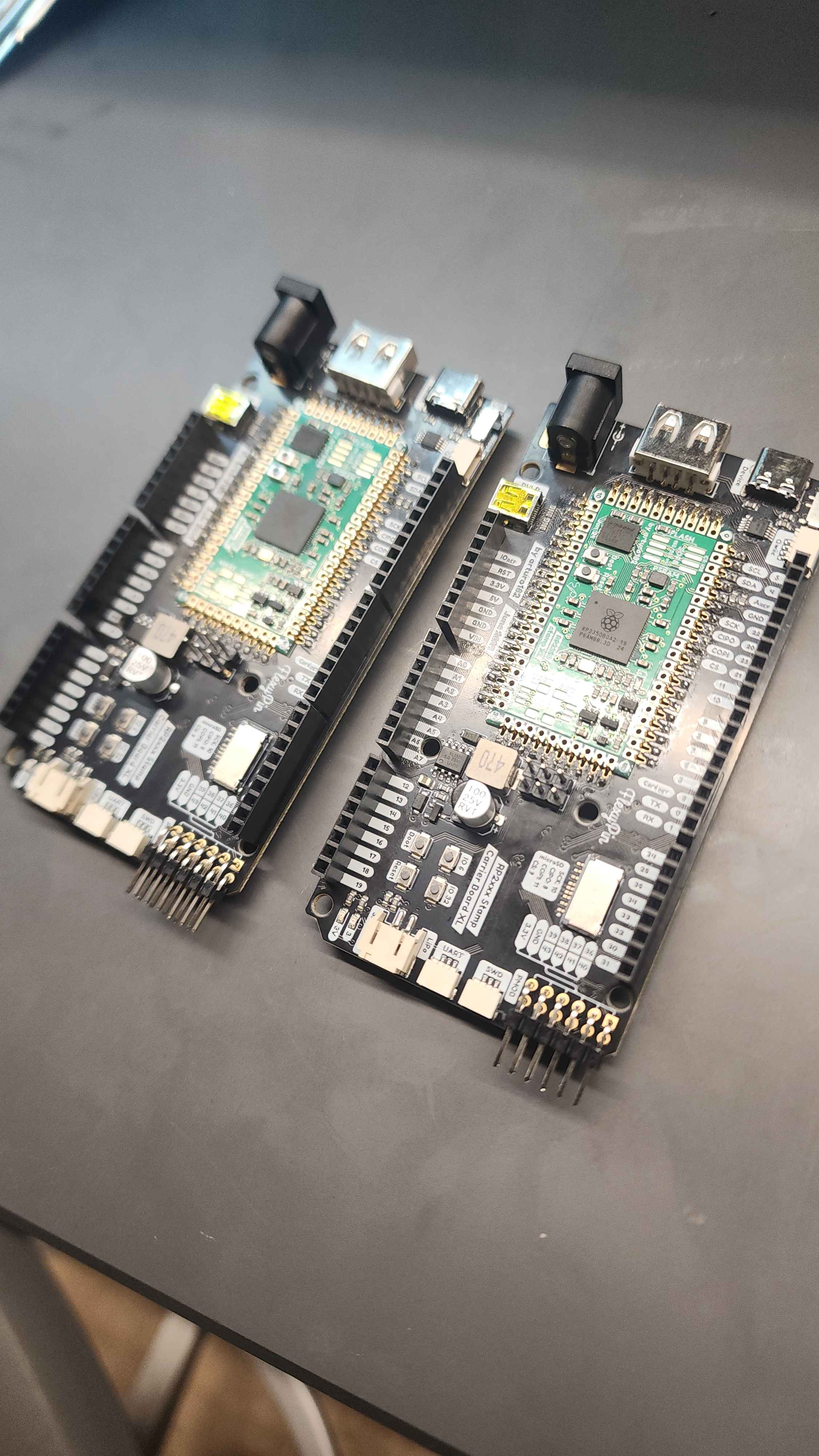 two assembled stamp carrier boards with stamp XLs on them